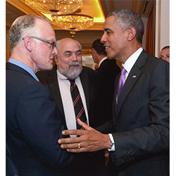 Fritz Folts '82 (left) shakes hands with President Barack Obama, who Folts commended for his recent efforts to curb animal poaching in Africa.