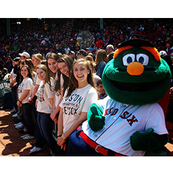 Members of The Shwiffs pose with Wally, the Boston Red Sox mascot, after singing the national anthem at the April 19 game.