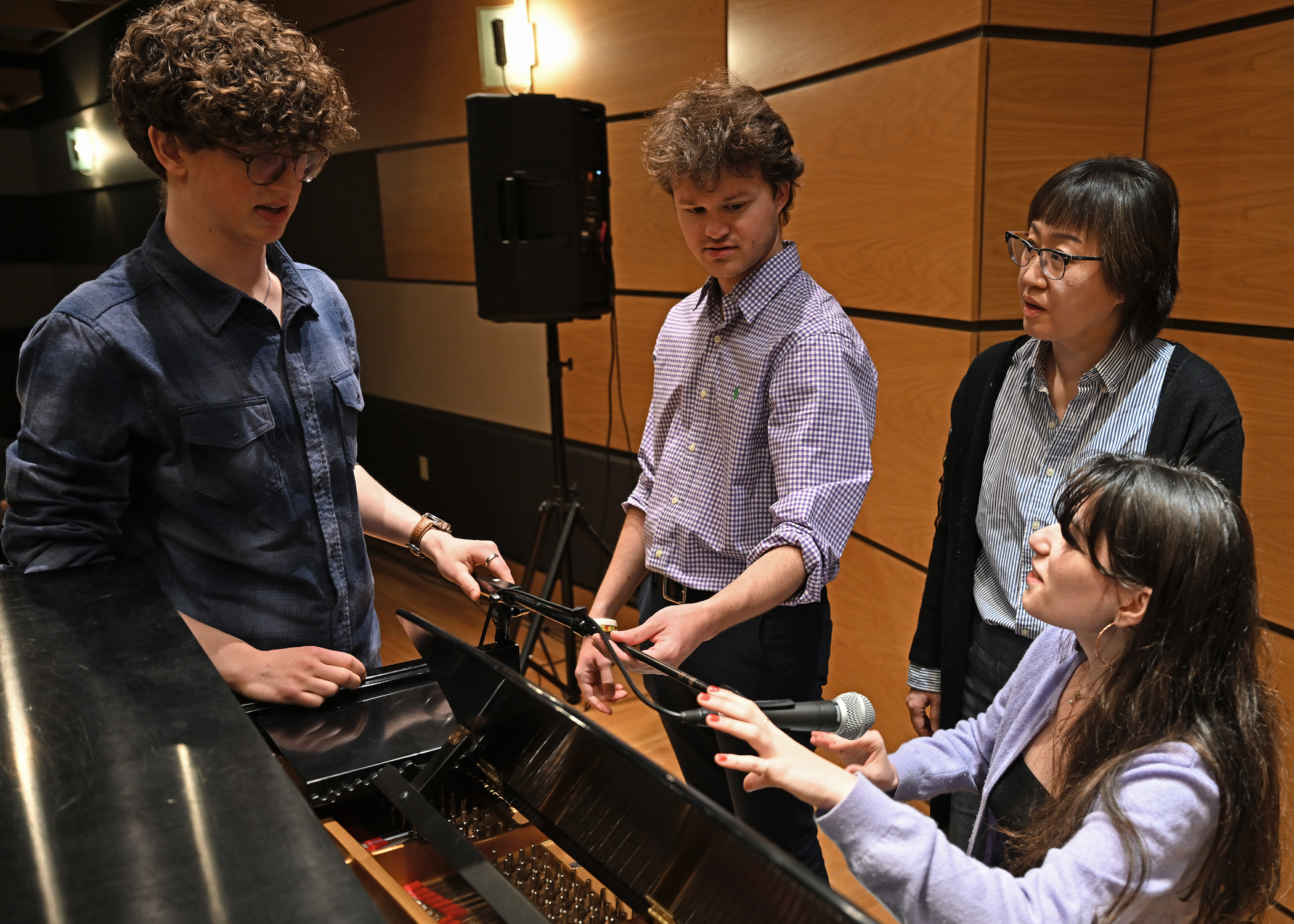 students around a piano