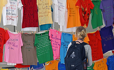 A student looking at t-shirts