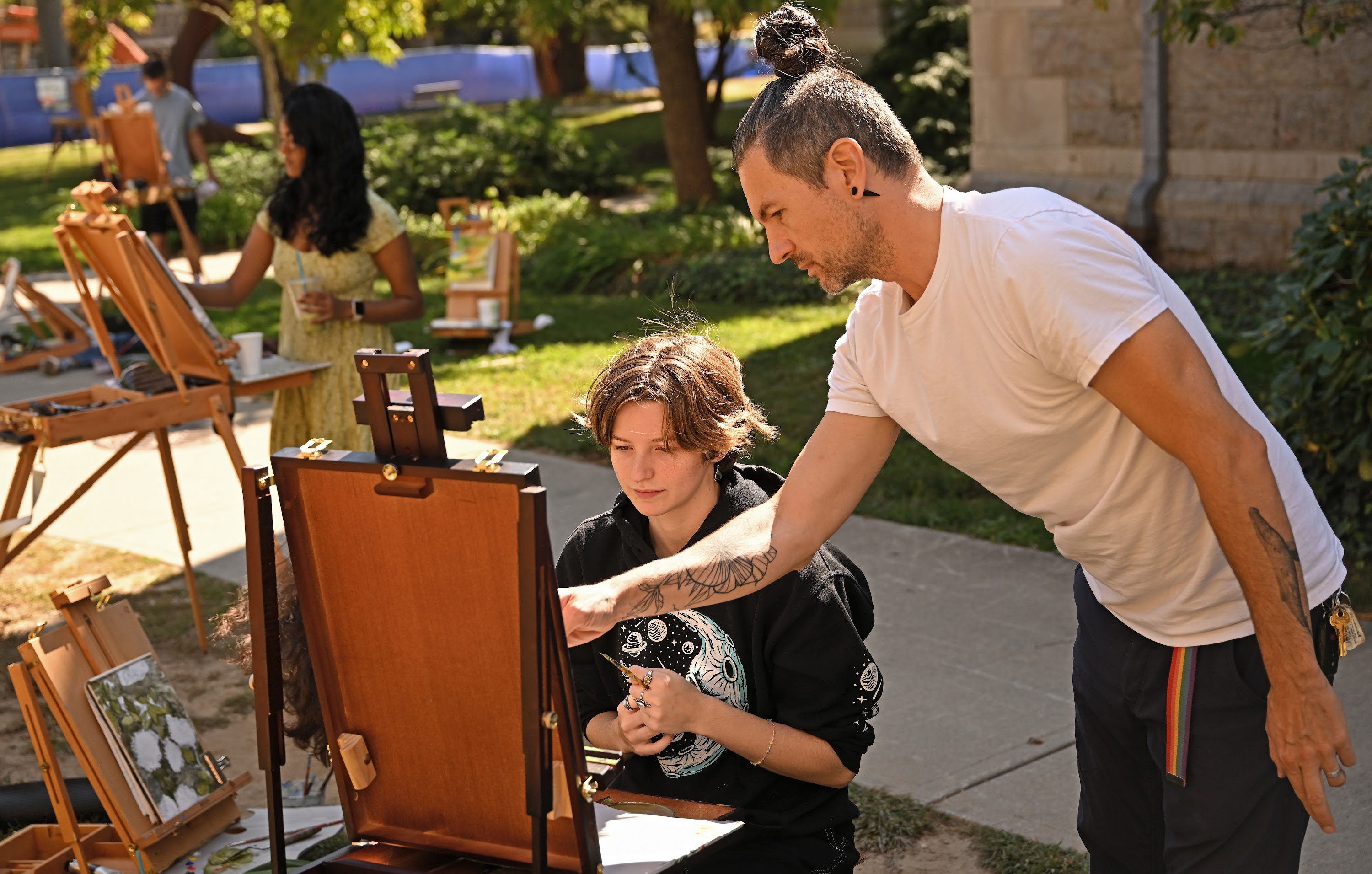 Students painting outside