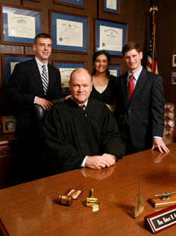 Pictured from left: Tom Giblin '10, the Honorable Robert H. Gardner '82, Aditi Juneja '12 and Steve Strauss '07.