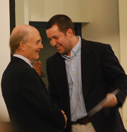 President Leo I. Higdon Jr. presents senior Nathan Cornell with the Lucy C. McDannel '22 Prize at the April 27 Honors and Awards Ceremony.