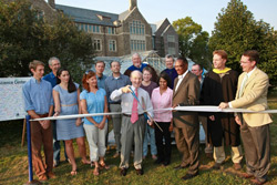 Surrounded by science faculty, students and College administrators, President Leo I. Higdon Jr. cuts the ribbon on the College's new $25 million Science Center at New London Hall.