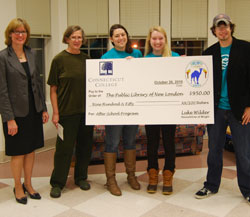 From left: Suzanne Maryeski, director of the library; Cris Staubach, head of youth services at the library; and Wright House student leaders Alicia Rea '12, Hadley Brooks '13 and Luke Wilder '11.