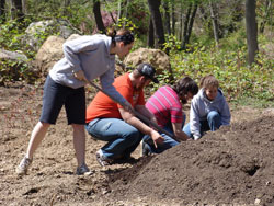 Students tend to the College's organic garden.