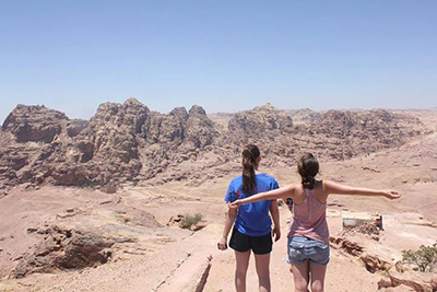 Arabic Studies students enjoy the view after a 2-hour hike up the mountains of Petra, Jordan.
