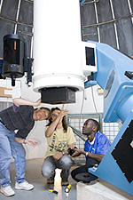 Students using the telescope in the Olin Observatory.